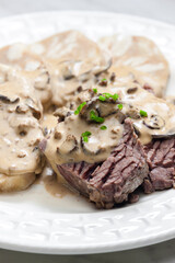 beef meat with mushroom sauce and dumplings