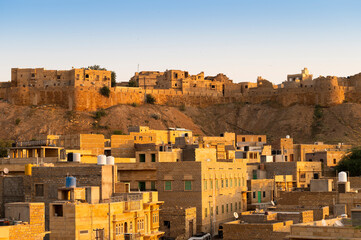 Obraz premium Jaisalmer,Rajasthan,India - October 15,2019: Jaisalmer Fort or Sonar Quila or Golden Fort. living fort - made of yellow sandstone. UNESCO world heritage site at Thar desert along old silk trade route.