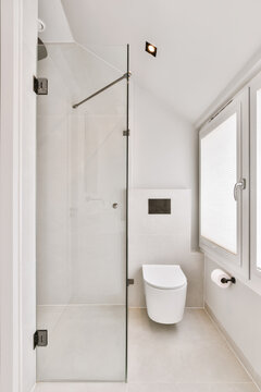 Interior of bathroom with toilet and shower cabin
