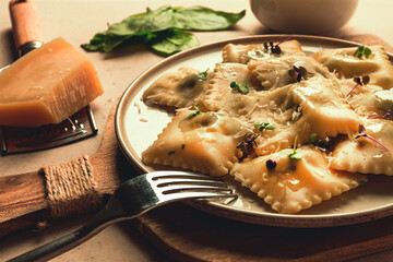 Ravioli with spinach and cheese, vegetarian food, on a beige background, no people.selective focus, rustic ,