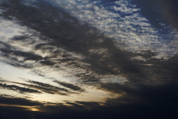 Spring sky at dusk at dawn. The sun barely breaks through the clouds and morning haze.Selective focus.