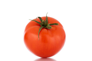 One red ripe tomato, macro, isolated on white background.