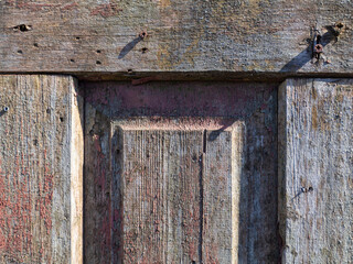 Old vintage wood lumber background. Colorful curly grunge texture wood surface backgrounds. Old and weathered wooden panels with peeling paint and rusty nails for an abstract background or frame