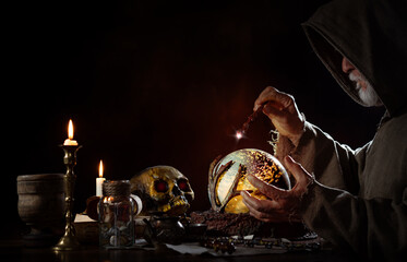 Medieval magician in his magic room
