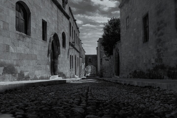 Fototapeta na wymiar Street of the knights in Rhodes Greece in Black and White.