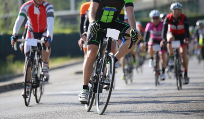 Obraz na płótnie Canvas cyclists ride on the racing bikes during the road cycling race