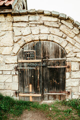 ancient wooden gate door to the stone fortress