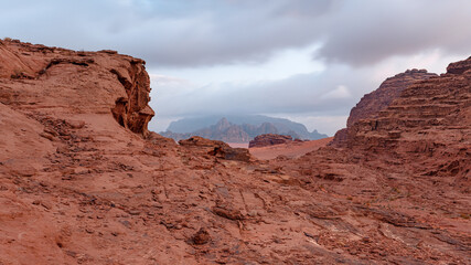 Red sandstone rocks formations in Wadi Rum also known as Valley of the Moon desert, Jordan, scene reminiscent to Mars planet