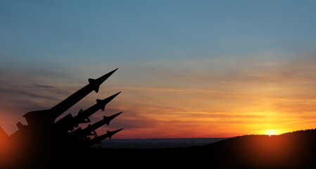The missiles are aimed at the sky at sunset. Nuclear bomb, chemical weapons, missile defense, a system of salvo fire.