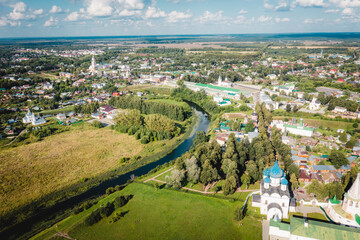 Aerial view panorama of cityscape of the Suzdal Kremlin on a bend of the Kamenka river. Russia, Vladimir region, Golden Ring of Russia