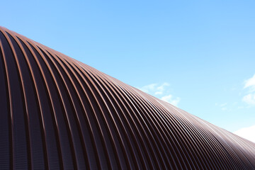 The roof of the hangar is made of stainless steel. Arched roof made of metal construction. An...