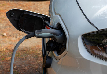 Close-up of an electric car in the process of charging 
