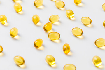 Close up of  oil filled capsules suitable for: fish oil, omega 3, omega 6, omega 9,  vitamin A, vitamin D, vitamin D3, vitamin E - Image