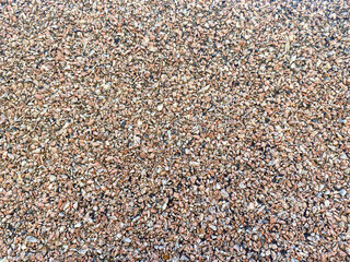 sports ground cover. rubber coating with small patches. pink rubber pebbles. material for sports, anti-slip coating
