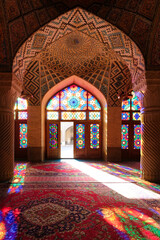 Naklejka na ściany i meble The Nasir-ol-Molk Mosque in Shiraz is also known as the Pink Mosque and it is wonderful if you visit it before 10 in the morning when the rays of the sun project the colored lights of the vitraux