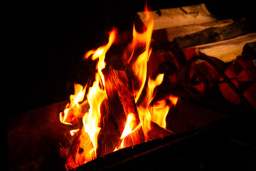 Fototapeta premium Mountain summer. Bonfire in night. Black background