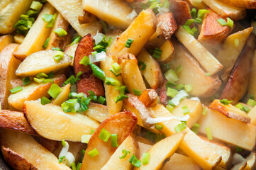 fried potatoes close-up. the concept of cooking vegetables. baked potatoes with onions