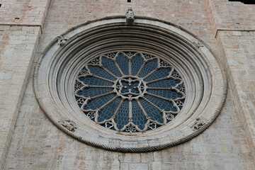 Fototapeta na wymiar The round window of Trento Cathedral in Trento, Italy. Close-up