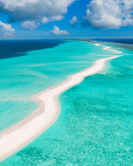 Beautiful aerial view of Maldives and tropical beach. Travel and vacation concept. Scenic view of exotic sandbank with ocean lagoon, coral reef. Luxury holiday destination, tourism vertical banner