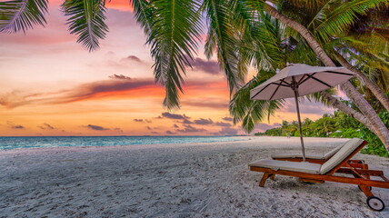 Beautiful beach. Chairs umbrella on sandy beach sea. Panoramic summer holiday and vacation concept...