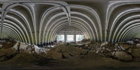seamless spherical hdri 360 panorama view inside of empty old hangar with pieces of broken concrete and building materials in equirectangular projection, ready for AR VR virtual reality content