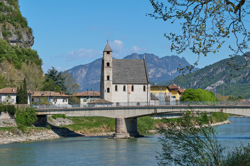 Fototapeta na wymiar View of the church of Sant'Apollinare near the Adige river in Trento, Italy