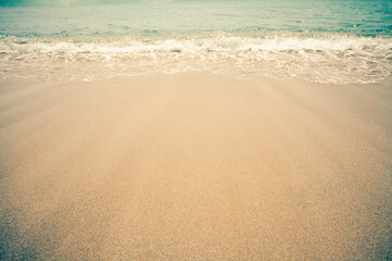 Fototapeta na wymiar Sea wave and sand. Nature horizontal copy space background. Vintage retro photo effect.