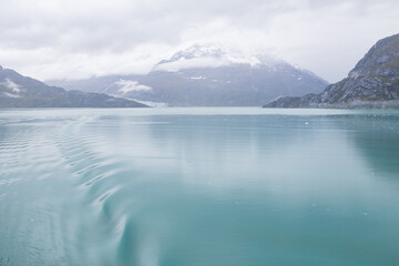 Ice chunks in the water and mountain background at Glacier Bay, Alaska, USA		