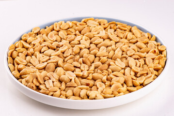 fried peanuts in a plate on a white background