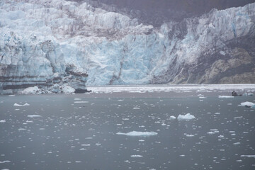 Ice chunks in the water and glacier in background at Glacier Bay, Alaska, USA
