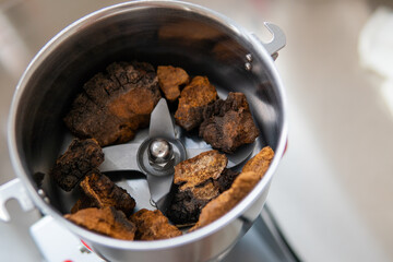 Powdered chaga mushroom powder. Medicinal chaga mushroom for brewing tea