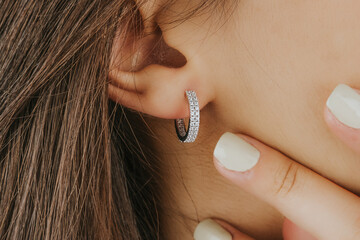 Beautiful girl. Fashion jewelry big earrings, dangle earrings and ball earrings for stylish and...