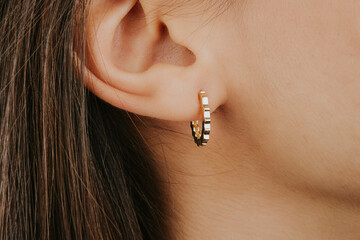 Beautiful girl. Fashion jewelry big earrings, dangle earrings and ball earrings for stylish and...