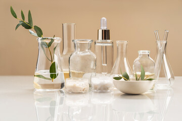 Alternative natural medicine and glassware, flasks and petri bowl. Alternative medicine herbs. Natural beauty skin care products. Concept research and development.