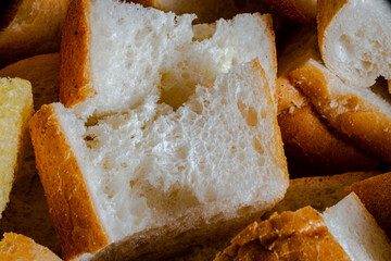 A crouton is a piece of rebaked bread, often cubed and seasoned.