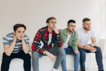 A group of friends watching a football match on TV. Football Fans