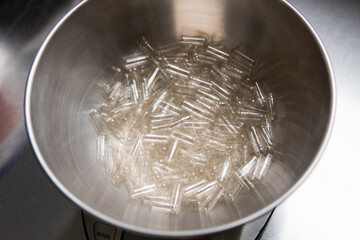 capsule filling machine. Transparent capsules for dietary supplements.