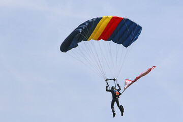 Skydiver flying wing in a blue sky	