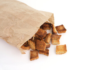 Fried breadcrumbs in a paper bag on a white background.Homemade food.
