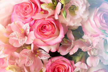 Festive bouquet of roses and alstroemerias with cold warm toning.