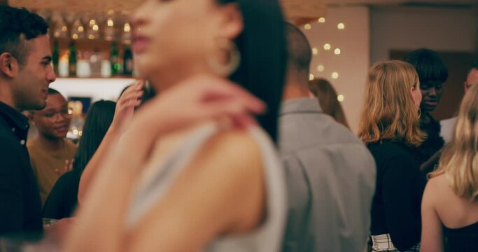 Confidence gets you noticed in a good way. 4k video footage of a group of young people having drinks and socialising at a party.