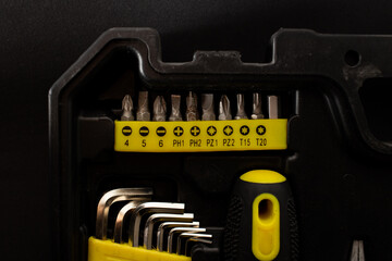 Toolbox, various devices and sizes, on black background, detailed shot