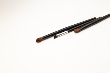 Makeup brushes on white background, template frame