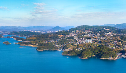 Fototapeta na wymiar Bird's-eye view of a seascape of Sasebo called Kujūkushima meaning 99 Islands famous for its saw-toothed coast with multiple islets part of Saikai National Park in Kyushu.
