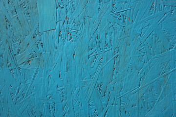 the panel is made of pressed wood sawdust, painted blue. wooden texture