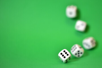 rolling dice on green background