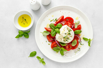 Salad Caprese with tomato, mozzarella and basil, italian food