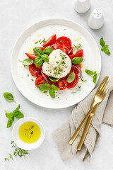 Salad Caprese with tomato, mozzarella and basil, italian food