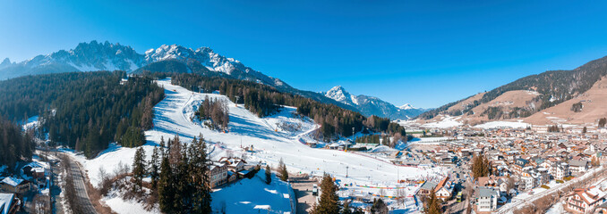 Panoramic view of snow mountain and townscape in south tyrol. Scenic white landscape against clear...