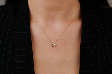 Close up necklace on necklace girl's neck. Beautiful woman wearing black jacket style with diamonds, six, diamond necklace, luxury fashion jewelry. - obrazy, fototapety, plakaty